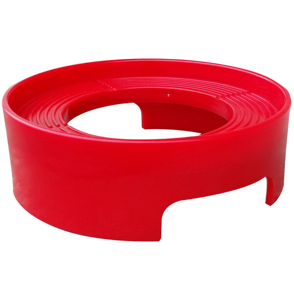 A red plastic circle with a hole in the center.
