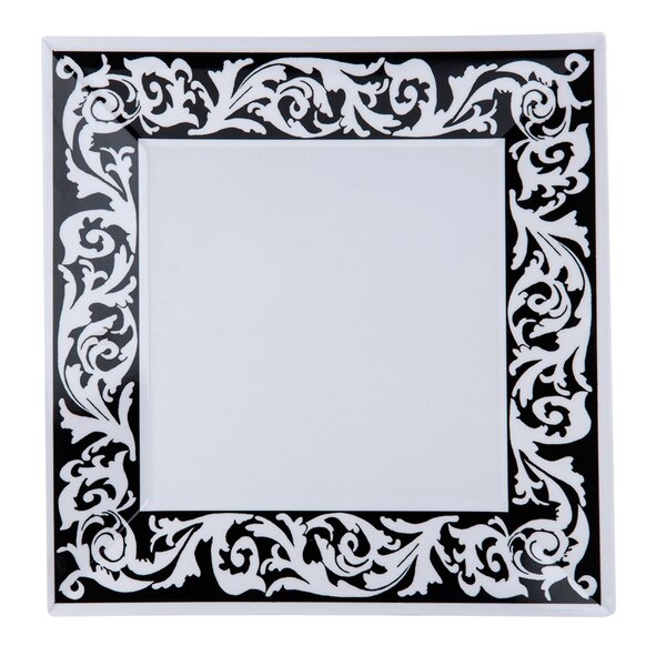 A black and white square melamine plate with a decorative design.