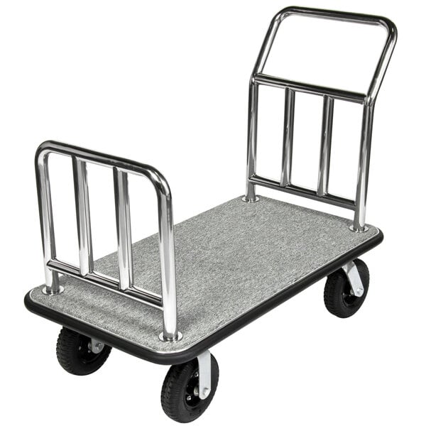 A CSL polished stainless steel luggage cart with grey carpeting and metal handles.