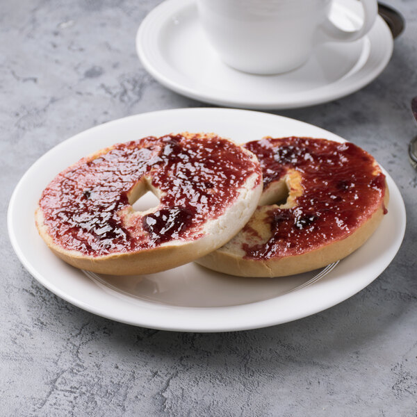 A Reserve by Libbey bone china side plate with a bagel and jam on it.