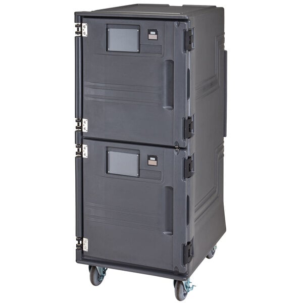 A large grey Cambro food holding cabinet with wheels and a door.