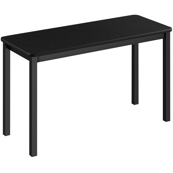 A black rectangular Correll lab table with legs.