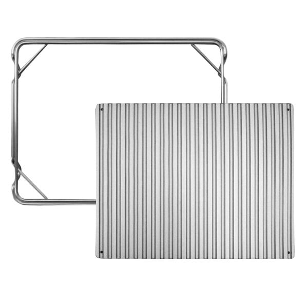 A metal tray with a silver finish on a metal table.