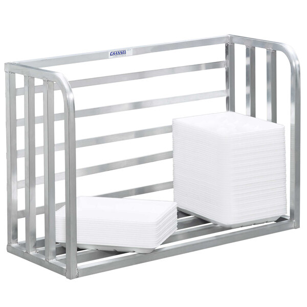 A metal rack with white plates stacked on it.