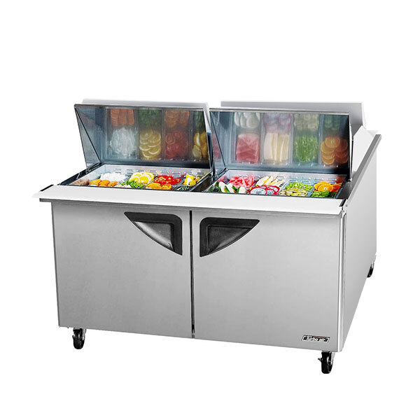 A Turbo Air 60" 2 door refrigerated sandwich prep table with trays inside.