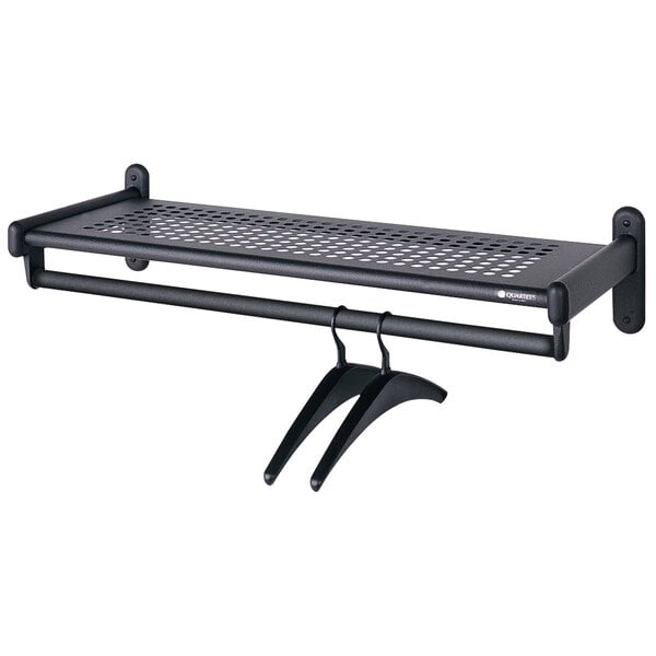A black Quartet metal garment shelf rack with hooks.