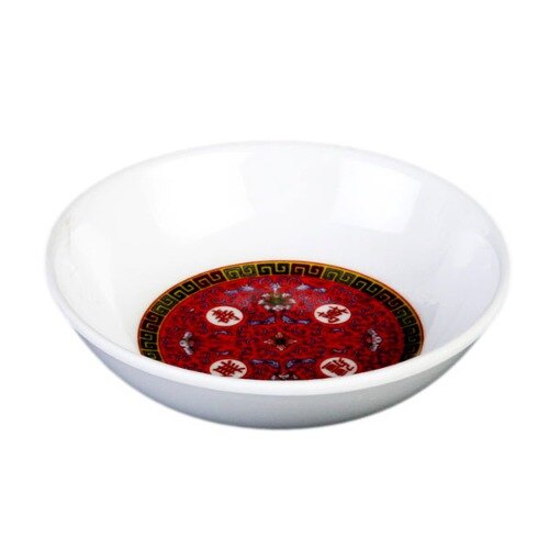 A white bowl with a red and gold Longevity pattern on it.