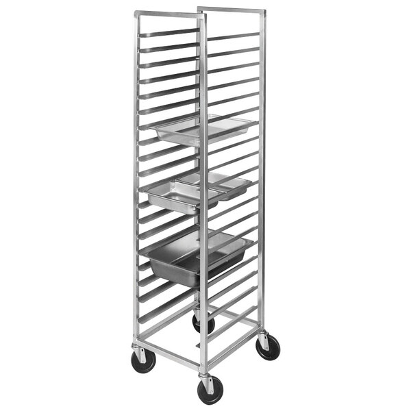 A Channel stainless steel steam table pan rack with metal trays on it.
