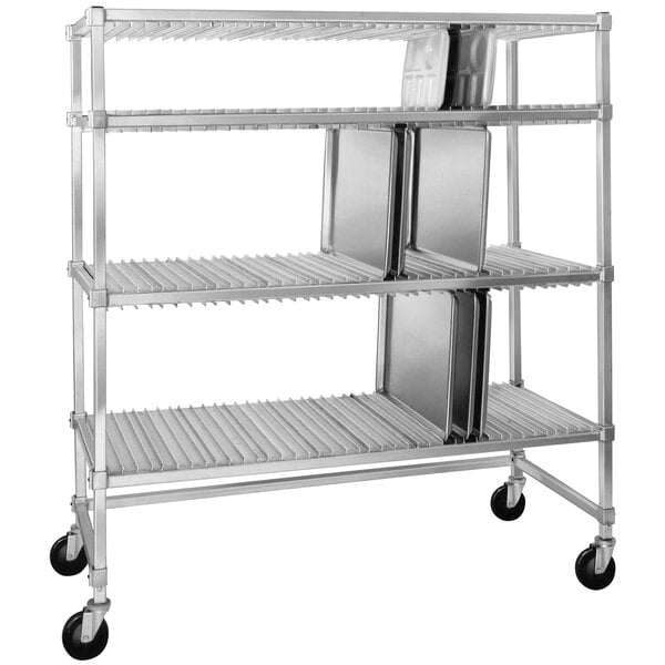 A metal Channel tray drying rack with three trays on it.