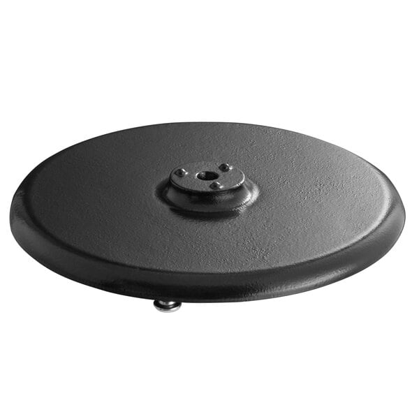 A black round cast iron table base plate with a hole in the center.