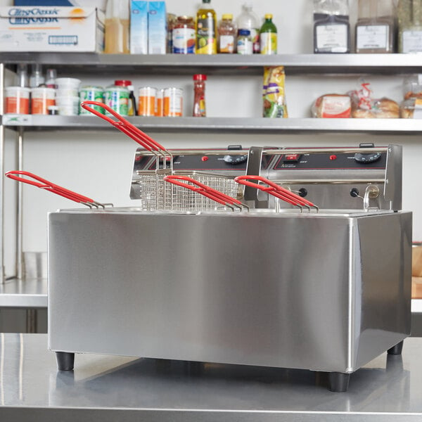 A Cecilware stainless steel electric countertop fryer with red handles.