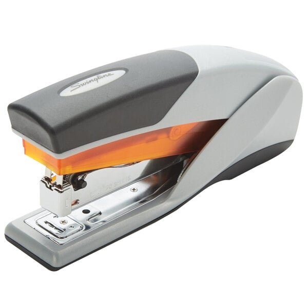 A grey stapler with orange accents.