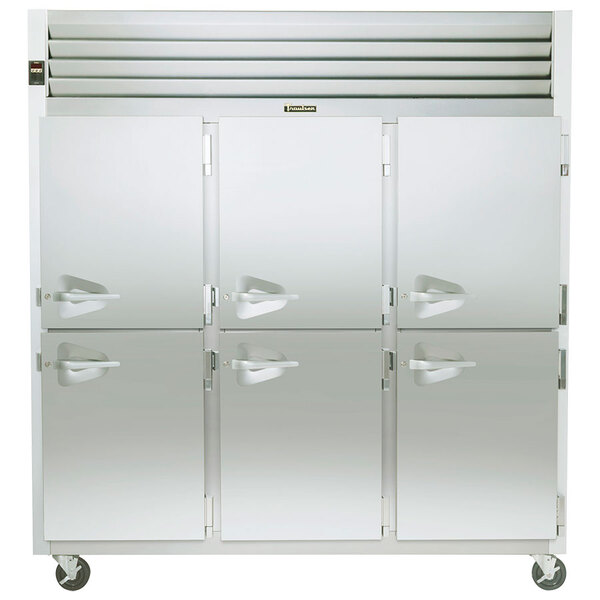 A Traulsen 3 section white reach-in freezer with white doors and handles.