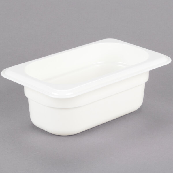 A white Cambro 1/9 size white plastic food pan.