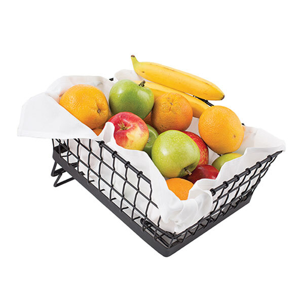 A black metal Tablecraft rectangular basket filled with fruit.