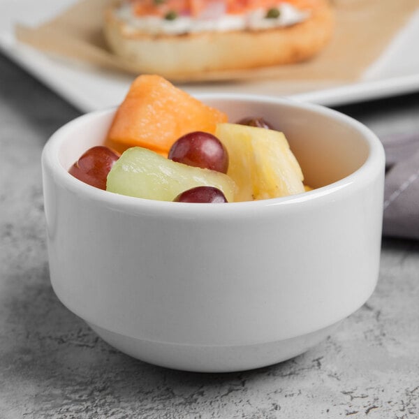 A bowl of fruit in a Libbey Porcelana white bowl.