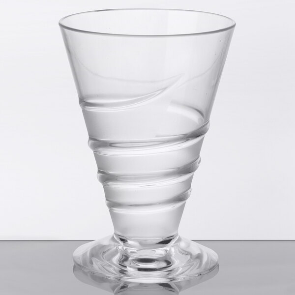 A clear GET cocktail glass with a twist on the bottom.