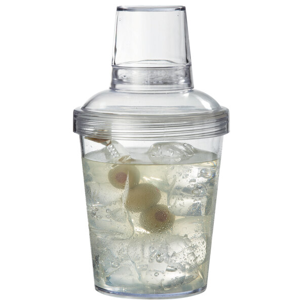 A clear plastic GET SH-176-1-CL cobbler cocktail shaker with a clear lid filled with a clear liquid, ice, and olives.