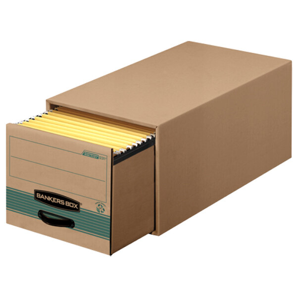 A Banker's Box storage drawer in a file cabinet with yellow files inside.