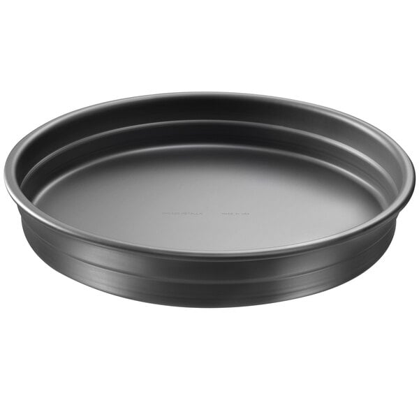 A black round pan with a white background.