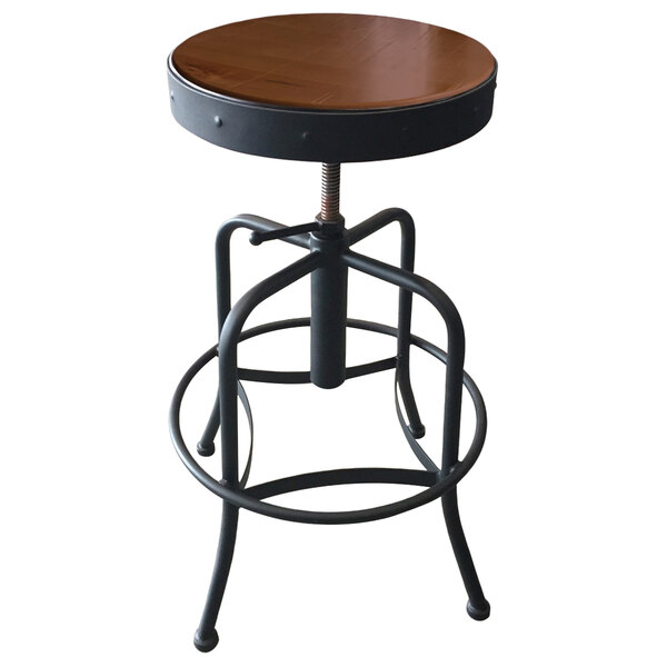 A Holland Bar Stool black steel height adjustable stool with a medium wood seat.