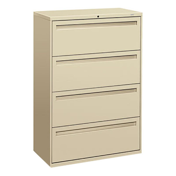 A tan filing cabinet with four drawers.