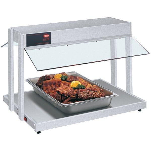 A Hatco countertop buffet warmer with a tray of meat.