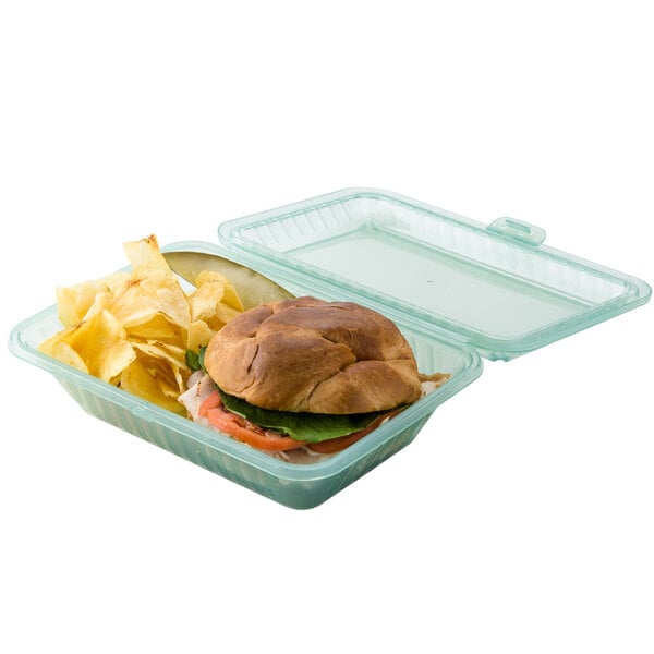 A sandwich and chips in a jade green GET Eco-Takeouts container.