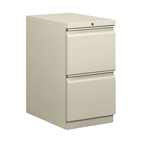 A light gray HON filing cabinet with two drawers.