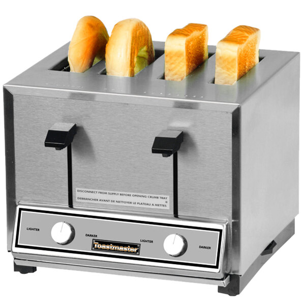 A Toastmaster commercial toaster with four slices of bread in it.