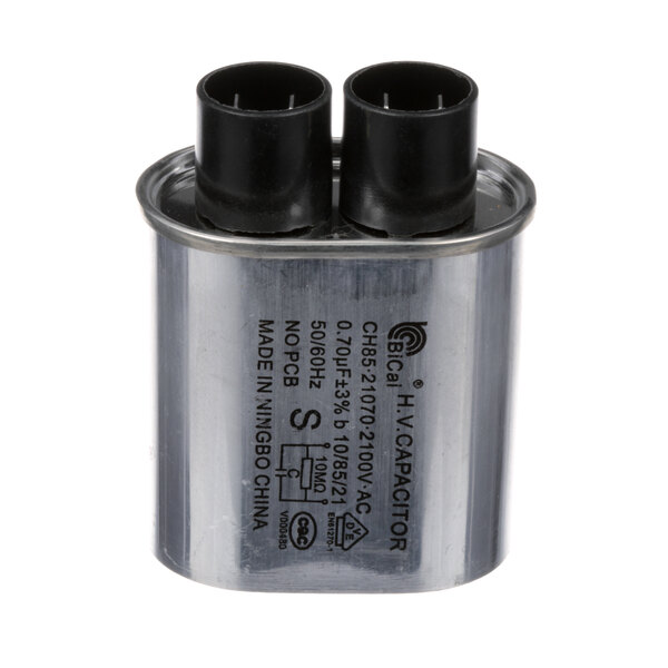A silver Amana capacitor with black caps on the ends.