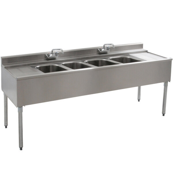 A stainless steel Eagle Group underbar sink with four compartments.