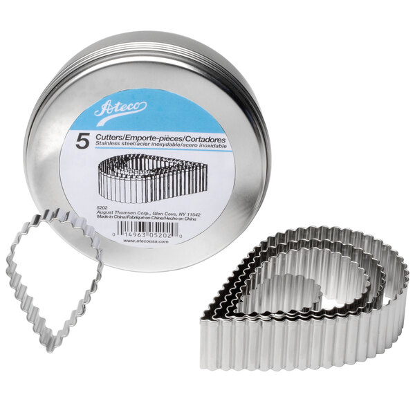 A metal tin with five Ateco stainless steel fluted tear drop cookie cutters.