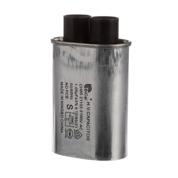 A metal capacitor with two black caps on each end.