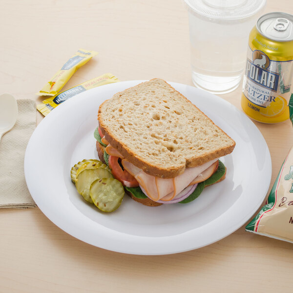 A sandwich on a Carlisle white melamine plate.