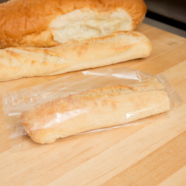 A loaf of bread wrapped in a LK Packaging plastic bag.