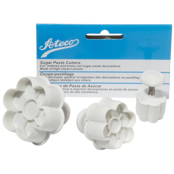 A blue package of white Ateco 6-petal flower shaped cookie cutters.