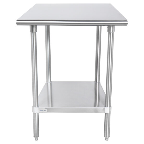 An Advance Tabco stainless steel work table with undershelf.