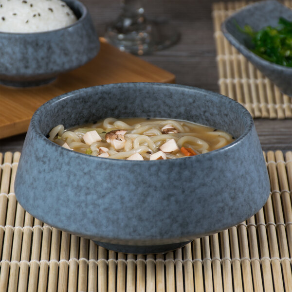 A Biseki stoneware bowl filled with noodle soup.