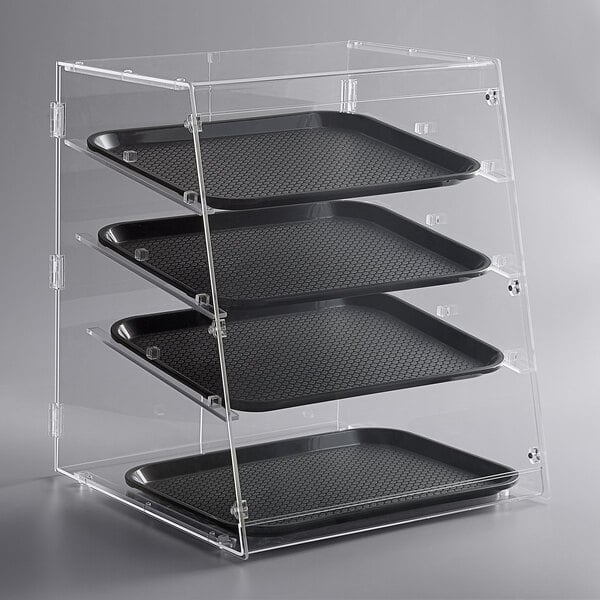 A clear plastic tray with four trays in a bakery display case.