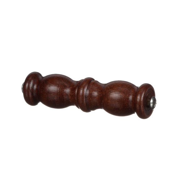 A wooden knob with a metal handle on a table.
