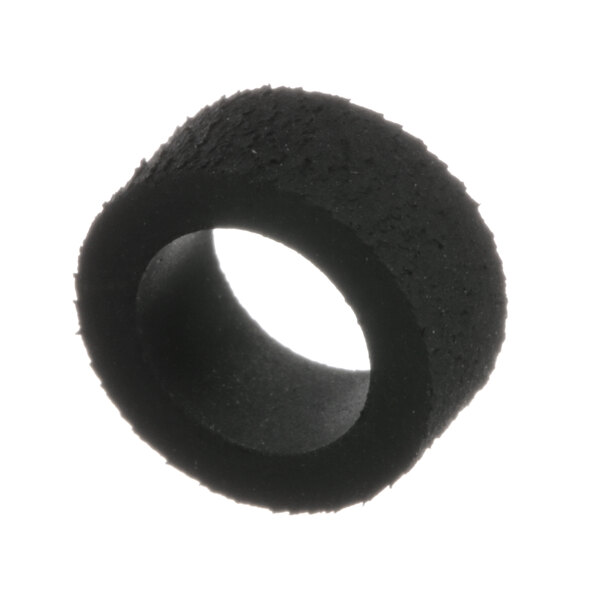 A close-up of a black rubber circle with a hole in the middle.