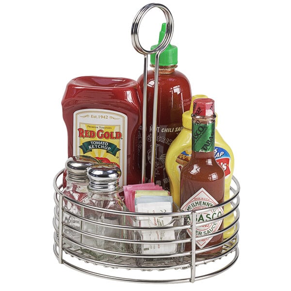 A Clipper Mill stainless steel condiment caddy with card holder holding condiments in glass jars.