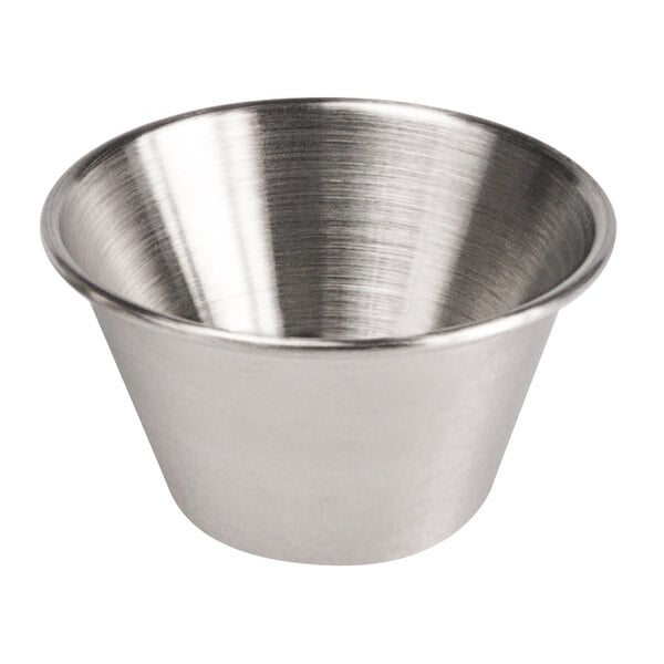 A close-up of a stainless steel Clipper Mill condiment cup.