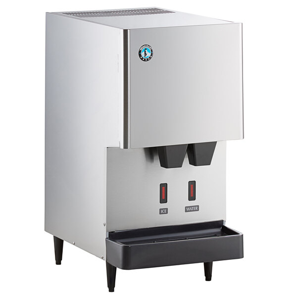 A stainless steel Hoshizaki countertop ice machine with a water dispenser and ice cubes.