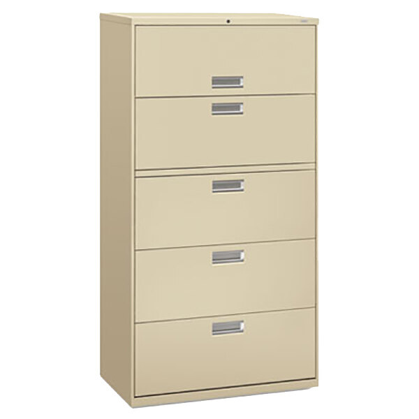 A tan metal lateral file cabinet with silver handles and four drawers.