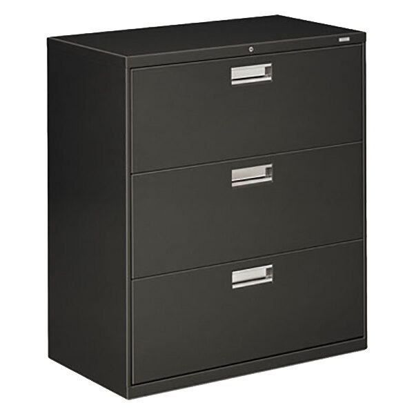A black HON metal lateral file cabinet with three drawers and silver handles.