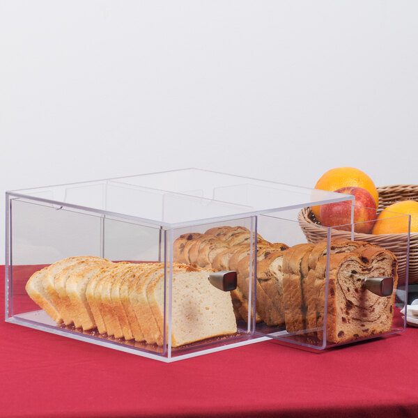A clear plastic Cal-Mil bread box with two drawers containing bread.