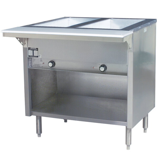 A stainless steel Eagle Group commercial liquid propane steam table with an enclosed base and open well with two pans.