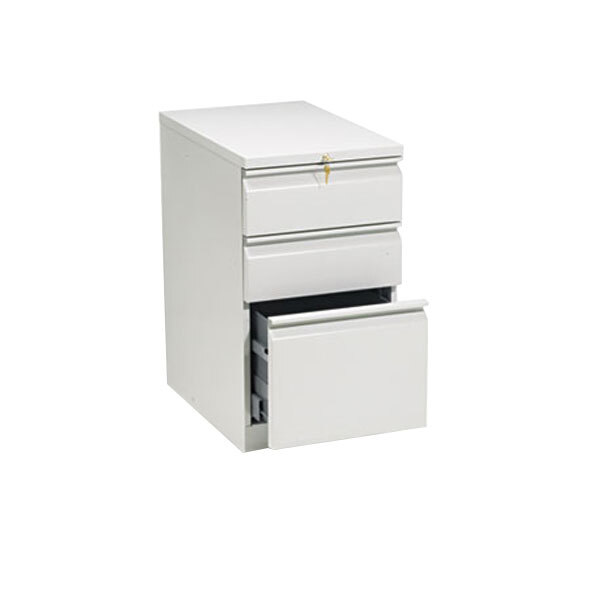 A light gray HON Brigade three-drawer pedestal filing cabinet with an open drawer.